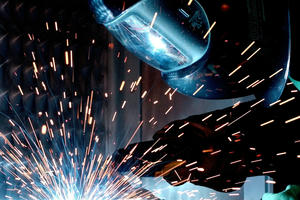 man welding steel